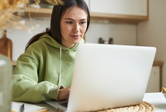 financial analyst using laptop