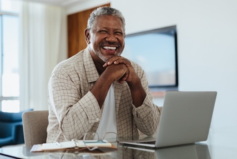  senior man working on laptop