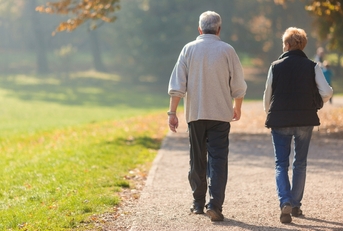 senior citizen couple taking a walk 