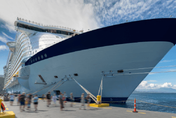 Large cruise ship with passengers disembarking