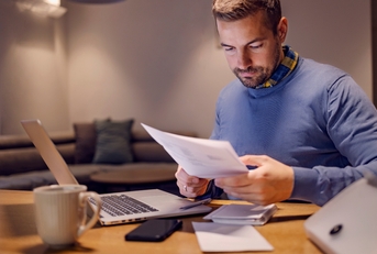 a casual businessman doing paperwork