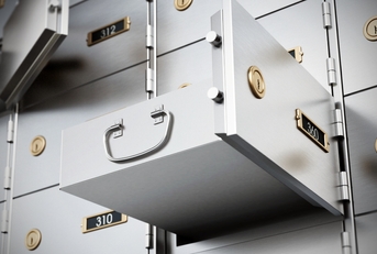 Bank deposit boxes with some open drawers