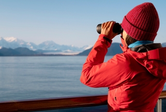 passenger looking at Alaskan mountains