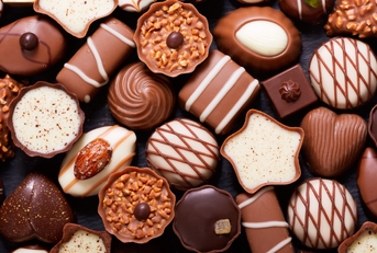 Mix of chocolate candies, top view