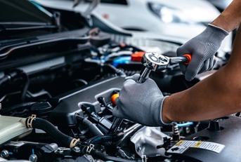 Mechanic doing maintenance on car