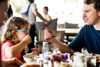 Guests having breakfast at hotel restaurant