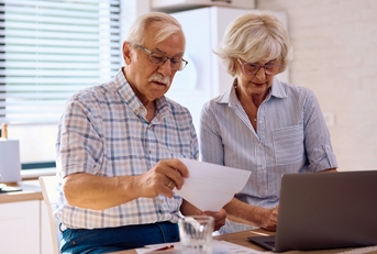 senior couple planning their household budget