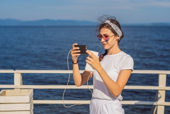Woman using mobile phone on vacation