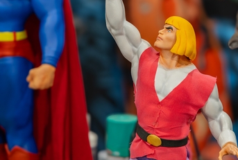 action figures of he-man and superman