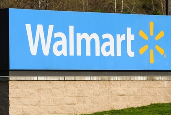 walmart roadside store sign in daylight green grass