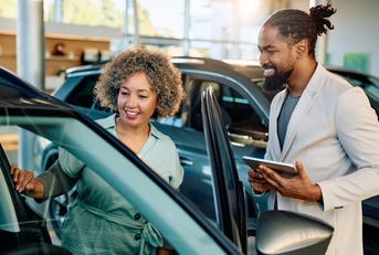 woman buying new car