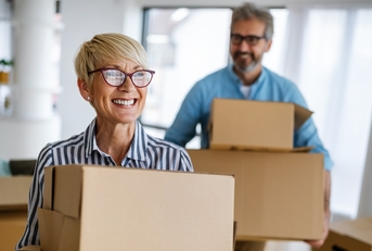 portrait of happy senior couple in love moving in new home