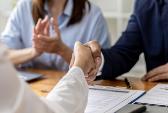 Managers and job applicants shake hands