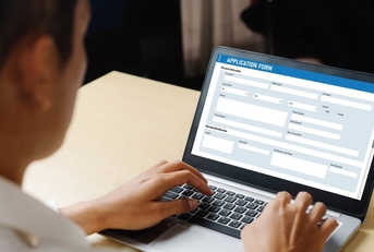 Man filling out online job application form