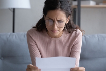woman in glasses frustrated and confused