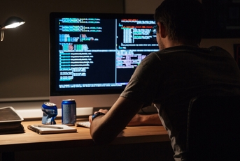 programmer sitting and writing code
