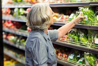 senior woman picking out some vegetables