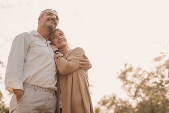 Happily retired couple at sunset