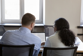 Mentor and intern editing text together