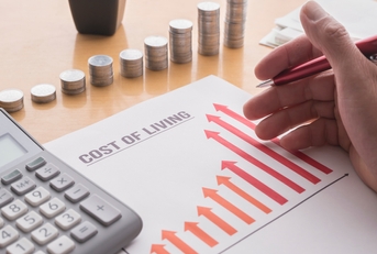 paper showing a graph of the rising cost of living 