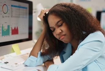 tired manager touching her head