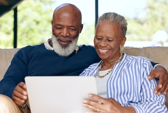 Senior couple relaxing watching movie
