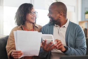 Happy man and woman with paperwork, budget and retirement fund with investment