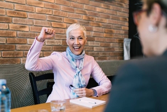 Happy senior woman after successful job interview