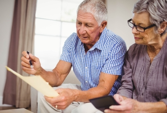 senior couple calculating bills