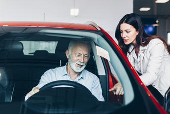 senior man choosing a new car