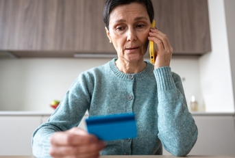 woman sending money to fraudsters