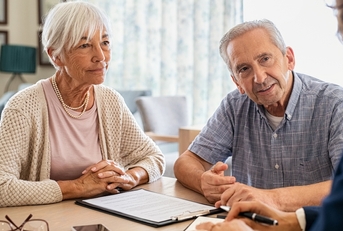 couple planning their investments with financial