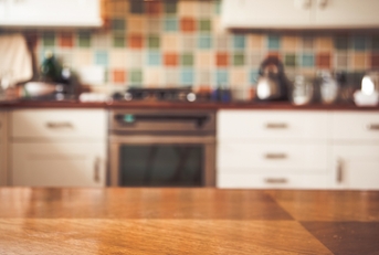 blurred kitchen interior and napkin and desk