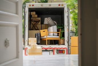 truck carrying goods moving house