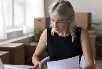 woman sit at office desk work with business papers