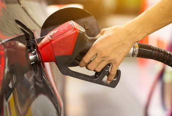 pumping gas at gas pump