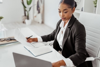 female hr manage using laptop