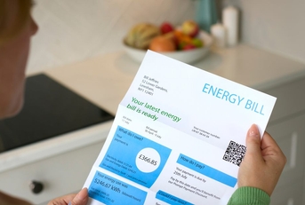 woman opening uk energy bill
