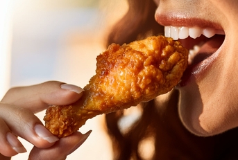 eating a chicken wing