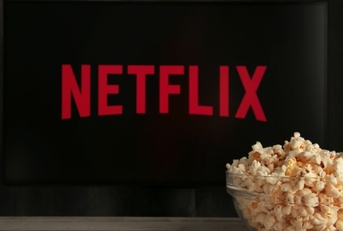 Netflix on TV with popcorn