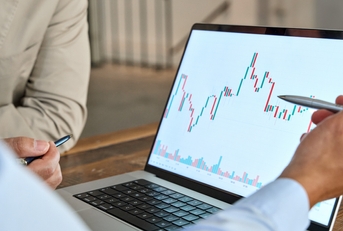 financial advisor explaining invest stock market data