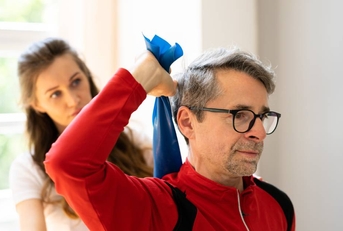 Man with occupational therapist