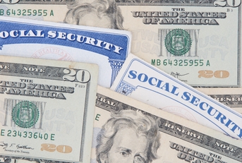 New and Old style Social Security cards with 20 dollar bills