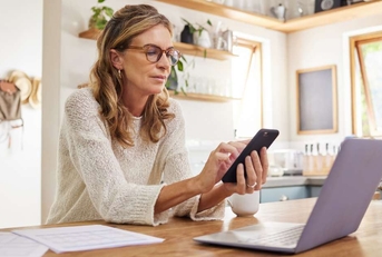 thinking mature person with technology