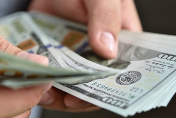 businessman counts money in hands