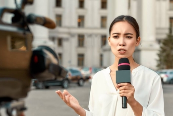 TV reporter presenting the news outdoors