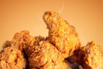 Fried chicken on orange background
