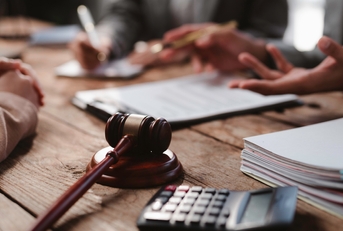 lawyers discussing contract during meeting in office