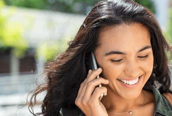 Smiling woman talking on phone