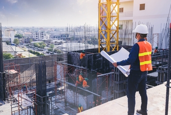 engineer inspecting and working outdoors